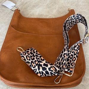 NWT vegan camel crossbody bag with leopard adjustable and removable strap.